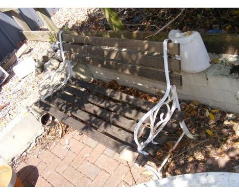 A garden bench with wrought iron ends