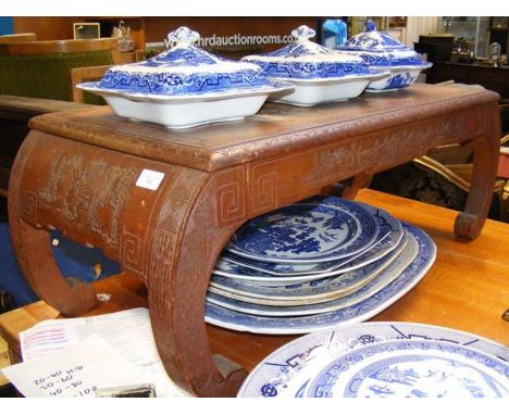 A hardwood coffee table with Chinese carvings 
