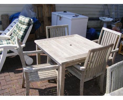 A teak 90cm square garden table with four matching chairs