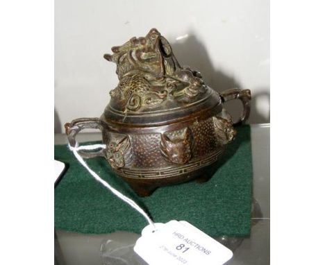 A bronze two handled pot and cover