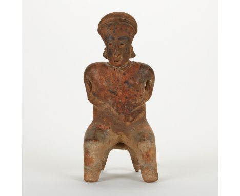 Large pre-Columbian Nayarit San Sebastian seated figure, polychrome ceramic. The female figure is seated on a two-footed stoo