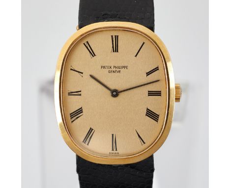 Patek Philippe 3548J ellipse wristwatch. The gold-colored dial with Roman numerals, and marked "Patek Philippe, Geneve." With