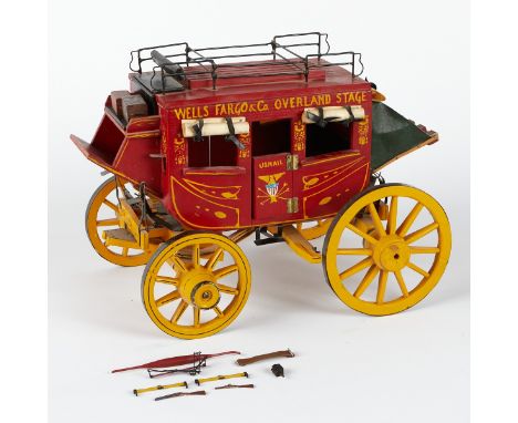 Hand painted Wells Fargo &amp; Co. U.S. mail overland stage coach model with luggage and rifle accessories.Height: 12 1/2 in 