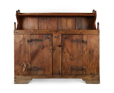 Welsh cupboard, 17th c. Lower section with two doors, surmounted by a single shallow shelf beneath a cornice with decorativel