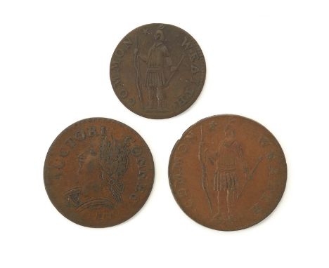 Group of three early American coins. One Massachusetts half cent depicting a Native American holding a bow and arrow encircle