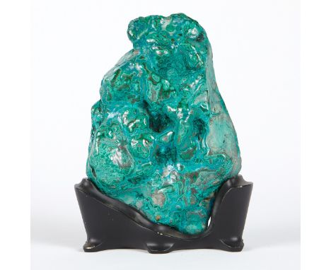 Large polished boulder of malachite intergrown with chrysocolla. The vibrant surface shows multiple bulls-eyes. On a custom w