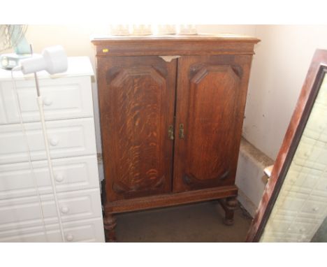 An oak two door cupboard