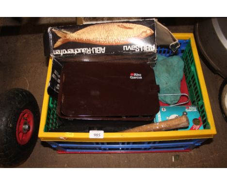 A box containing an Abu Garcia smoke box; various tools