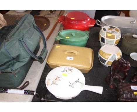 A Le Creuset casserole dish and cover; together with one other cooking dish; a terrine etc