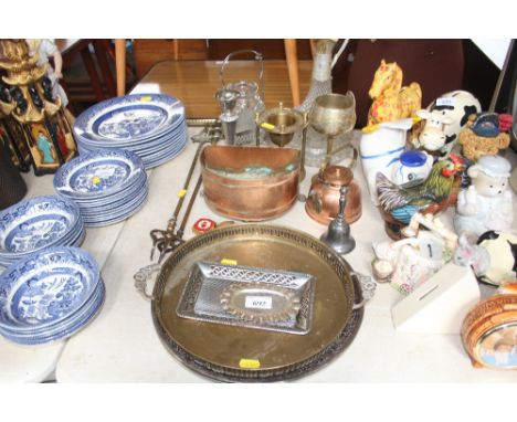 A quantity of various metalware to include trays; a candle stick; toasting folks etc