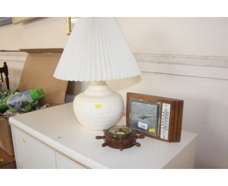 A table lamp and shade together with two barometers