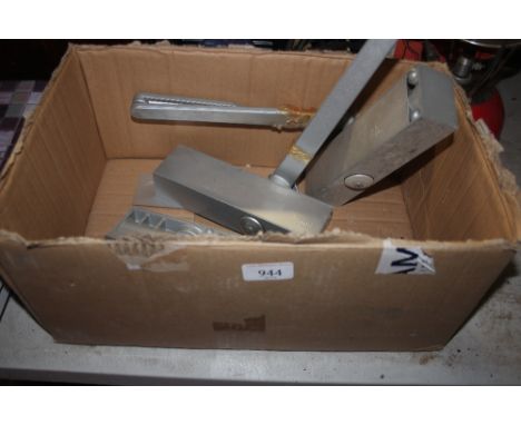 A box containing three door closers