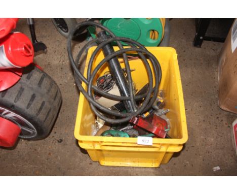 A box containing oil cans and tools