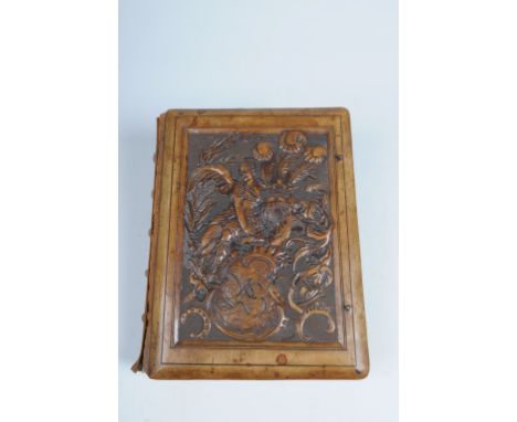 A Victorian leather photograph album
The rectangular hinged cover stamped with a winged maiden beside a helmet surmounted wit
