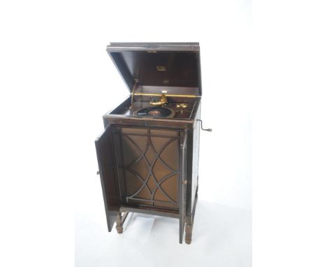 An HMV model 194 mahogany cabinet gramophone
Distressed, the rectangular hinged cover enclosing gold plated fittings with HMV