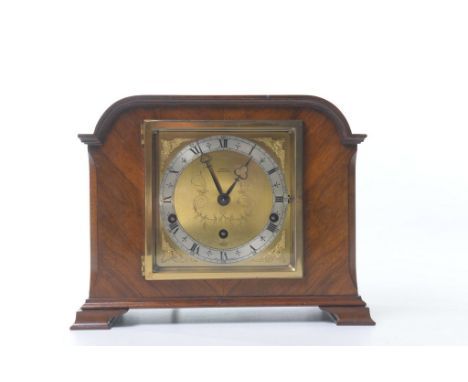 A walnut veneered Westminster and Whittington mantel clock by Elliott
With a 13cm silvered chaptering, the inner gilt roundel