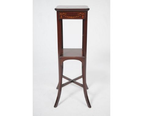 A choice Edwardian inlaid mahogany urn stand
The square top with canted angles and a moulded border and a frieze finally inla