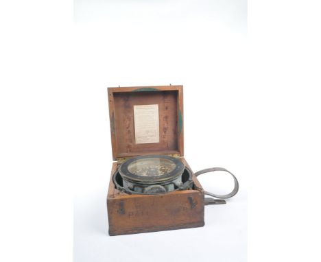 A Kelvin Bottomley & Baird Ltd brass ships compass, cased
The rectangular hinged walnut case enclosing the compass with a sig