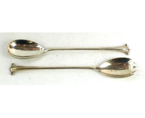 A pair of Edward VII silver salad servers 
Each with scrolling fluted stem, extending to a bowl and fork terminal, 29cm long,