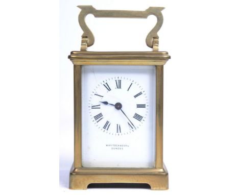 A gilt brass French carriage timepiece.  With a 6cm white enamel dial signed Whytock & Sons Dundee, with Roman numerals, sing