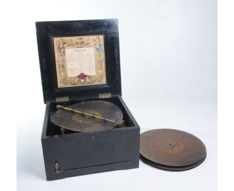 A 27cm Symphonion disc musical box
German circa 1910, the centre drive disc playing on two comb's No: 104743 contained in an 