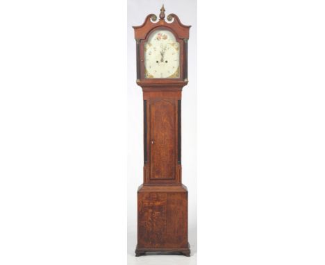 An early 19th Century oak and mahogany longcase clock, unsigned
With a 33cm white arched dial with repainted Arabic numerals,