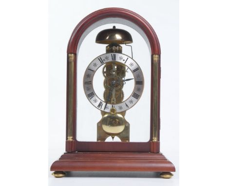 A Hermle, striking mantel clock.  With an 11cm dial with Roman numerals, blued hands, the single-train movement striking on a