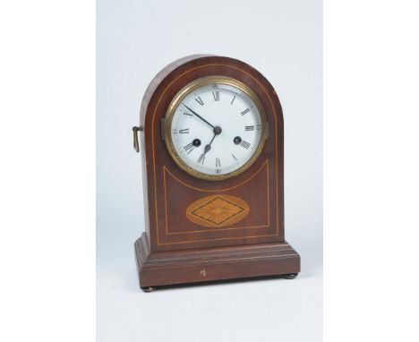 An Edwardian inlaid mahogany mantel clock
With a 13.5cm convex dial with Roman and Arabic numerals, the two train key wound m