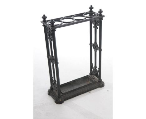 A Victorian cast iron stick or umbrella stand of Coalbrook design
Of upright rectangular form with turned finials and four 9c