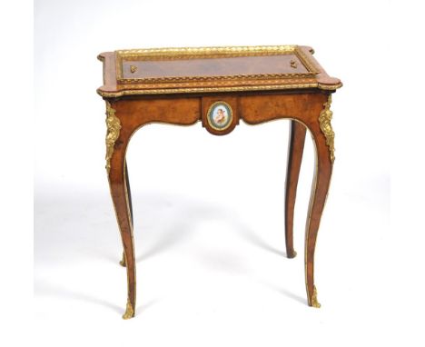 A Louis XV style walnut Kingwood crossbanded gilt metal and porcelain mounted table jardiniere
Late 19th century the rectangu