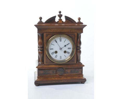 A late 19th Century walnut mantel clock
With a 10cm convex white dial with Roman numerals, blued hands, the two train key wou