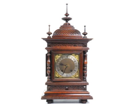 A Victorian carved oak bracket clock signed W & H Sch.  With a 14.5cm brass dial with a silvered chapter ring with Roman and 