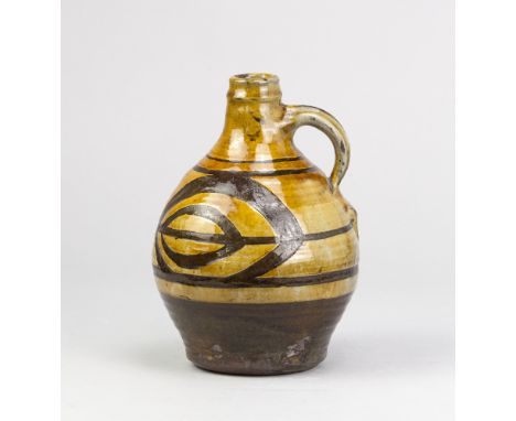 MICHAEL CARDEW (1901-1983) for Leach Pottery; a slipware flagon partially covered in galena glaze with wax resist decoration,