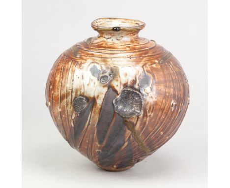 ALEX SHIMWELL (born 1980); a stoneware jar covered in shino and ash glaze, side fired on shells, impressed S mark, height 23c