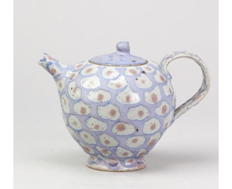 JANICE TCHALENKO (1942-2018); a stoneware teapot covered in a lilac glaze pattern with copper red dots, height 14cm, with a d