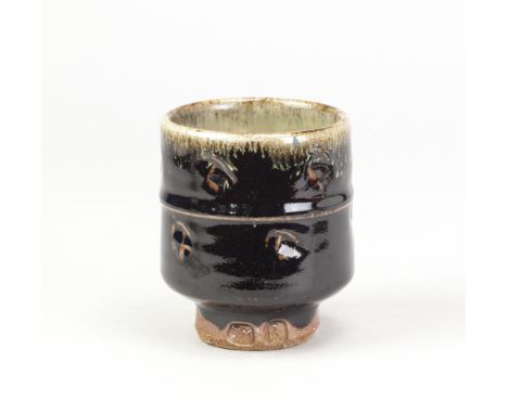 JIM MALONE (born 1946); a stoneware yunomi covered in tenmoku glaze with impressed decoration, impressed JM and B (for Burnby