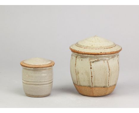 RICHARD BATTERHAM (1936-2021); a cut sided stoneware jar and cover, green ash glaze, height 14.5cm, and a smaller example (2)
