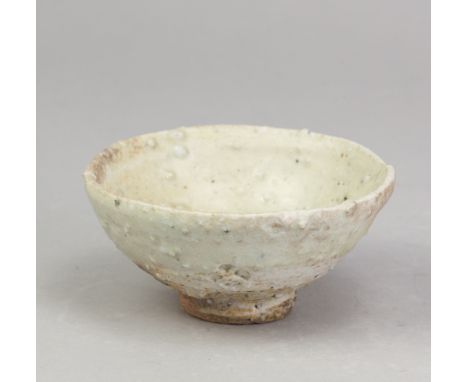 CHARLES BOUND (born 1939); a wood fired grogged porcelain open bowl covered in celadon glaze, impressed marks, diameter 11.5c