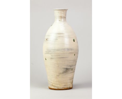 JIM MALONE (born 1946); a tall stoneware bottle covered in hakeme glaze with copper green spots, impressed JM and L (for Less