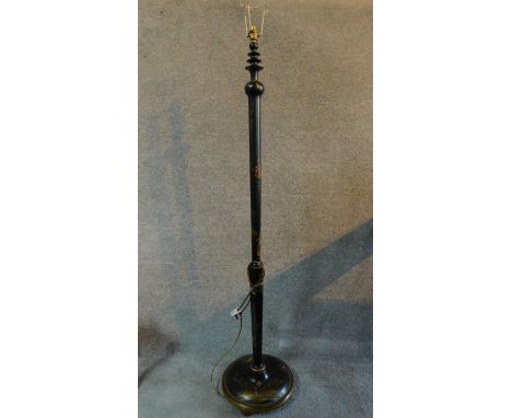 A black lacquered Oriental ebonised and gilded standard lamp with hand painted floral design. H.167cm 