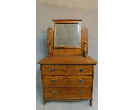 A late 19th century oak three drawer dressing chest with leaf carving and raised on bracket supports. H.144 W.84 D.44cm 