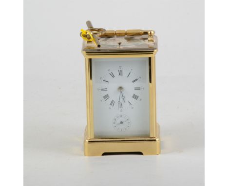 French brass cased carriage clock, the case with printed panels, repeating movement striking on a gong, with alarm, 15cm.