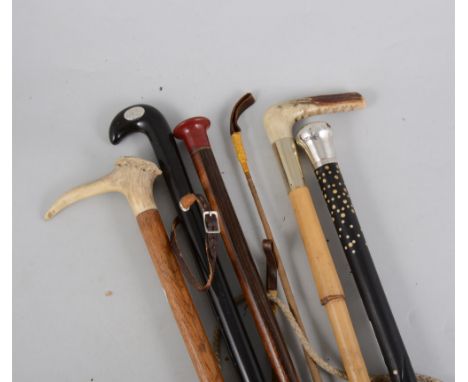 A collection of canes and crops, a Bagnall hunting crop, a cane with silver coloured top, stags horn walking stick, etc.