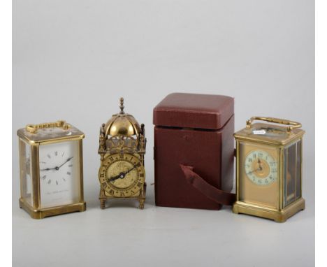 Brass carriage clock, enamelled dial, 15cm, leather travelling case, another brass cased carriage clock and a miniature lante