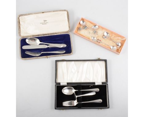 A tray of silver flatware to include a cased christening silver spoon, fork and pusher set, another walker &amp; Hall set wit