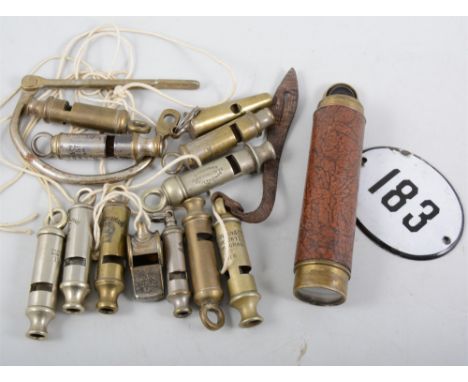 Collection of police whistles, enamel plaque 183 and a small telescope.