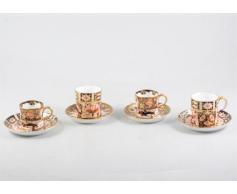 Five Royal Crown Derby coffee cans and saucers, Imari pattern number 4591, two large coffee cans and saucers, Imari pattern n