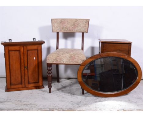 Small oak wall cabinet, oak sewing table, oak dining chair and a walnut framed oval wall mirror, (4).