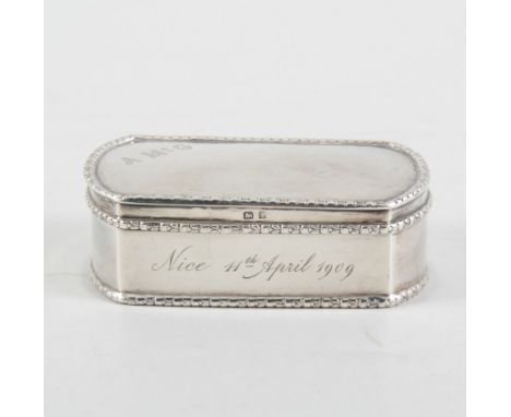 A Mappin &amp; Webb Ltd silver snuff/trinket box, rectangular with curved ends, plain polished finish with laurel leaf cast b