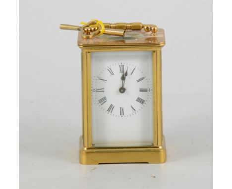 Brass carriage clock, white enamelled dial, non striking movement, 12cm.